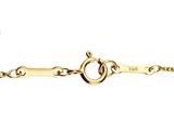 a close up of a gold bracelet with a heart on it