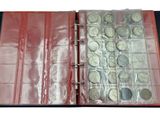 a red binder with coins in it on a white background