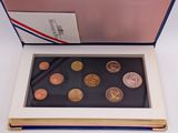 an image of a box of coins sitting on top of a table