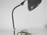 an image of a green desk lamp with a cord attached to it