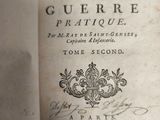 an old book with writing on it sitting on a table