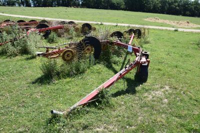 a tractor that is sitting in the middle of a field