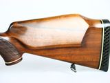 a close up of a rifle on a white background