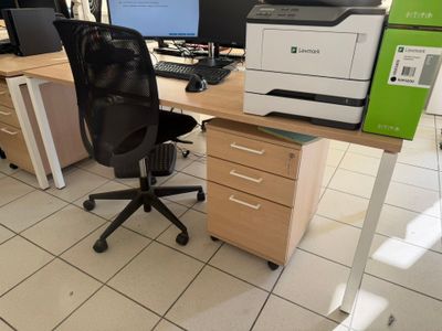 a computer desk with a printer and a printer on it