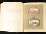 an open book with a picture of a couple of pictures on it