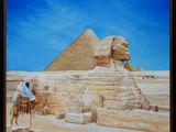 un tableau représentant un homme à dos de chameau devant une pyramide