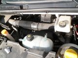 a picture of a car engine with its hood open