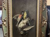 a picture of a painting of birds in a frame