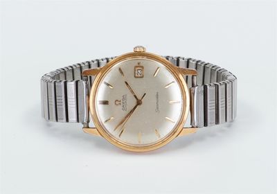 an image of a gold and silver wrist watch on a white background