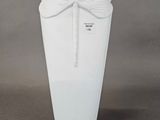 a white vase with a dragonfly decoration on it
