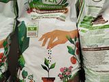 three bags of pur ver plant fertitor sitting on a shelf