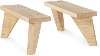two wooden benches sitting next to each other on a white surface