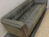 a couch and a chair sitting in a room