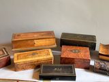 many different types of wooden boxes on a table