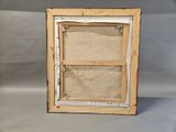 an old picture frame with a picture hanging on the wall
