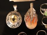 many different rings and jewelry items on a table