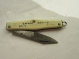 a small knife that has a handle on it