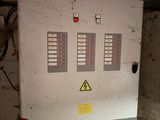 a electrical panel in a building with a lot of wires