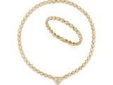 un ensemble composé d'un collier et d'un bracelet en or sertis d'un diamant