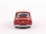 a red toy car with a white top on a white surface