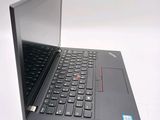 a laptop with a black keyboard on a white surface