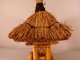 a small thatched hut with a thatched roof