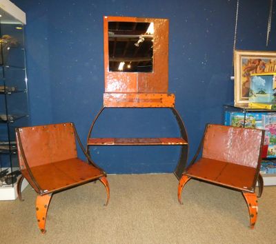 two chairs that are sitting in front of a mirror