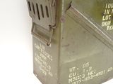 a small metal box with a metal lid on it