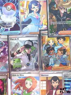 a lot of different pokemon cards on the table