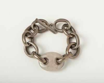 chain bracelet with a padlock on it on a white surface