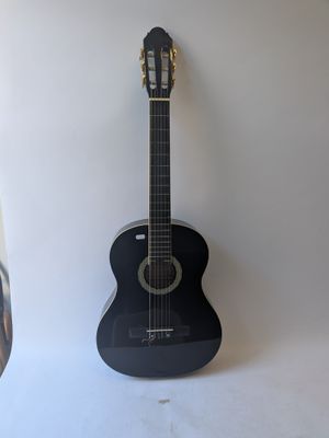 a guitar that is sitting on a white surface