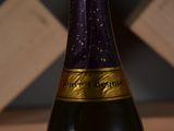 a bottle of wine that is sitting on a table