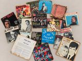 an image of a pile of old music books on a table