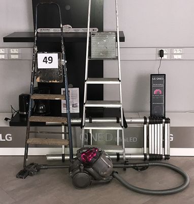 a picture of a room with a television and a vacuum