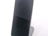 a cell phone that is sitting on top of a stand
