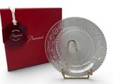 the glass plate is next to a red box with a tag on it