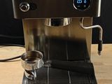 a coffee machine that is sitting on a wooden table