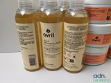 four bottles of avrill are lined up on a table