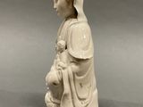 statue of a woman holding a baby in her arms