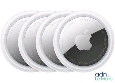 four white round coasters with an apple logo on them