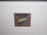 a picture of a sign on the side of a refrigerator