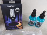 two bottles of vapor sitting next to each other on a table