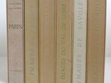 quatre livres sont empilés sur une surface blanche