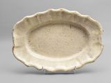 bowl with scalloped rim and raised rim