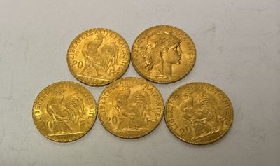 five gold sovereigns of various sizes and shapes