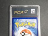 a close up of a pokemon card in a plastic case