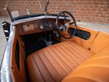 a brown leather car with a steering wheel and dashboard