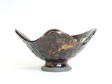 a small bowl with a decorative design on it