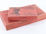 two boxes of train tickets sitting on top of each other