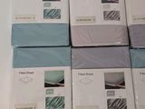 several sheets of blue and white are stacked on top of each other